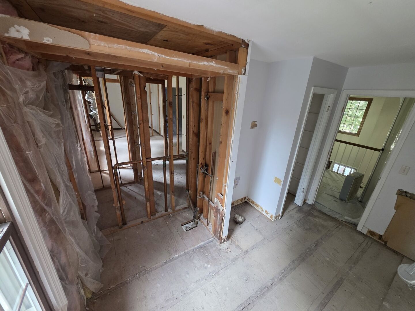 Interior room with framing exposed after demolition